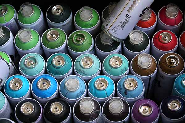 An image of spray paint cans, photo by David L. Ryan for The Boston Globe